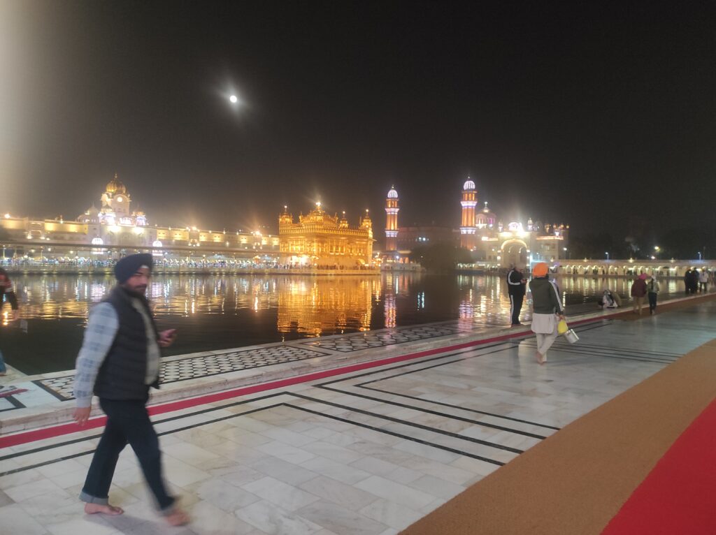 Close view of Golden Temple Amritsar architecture surrounded by the holy Sarovar