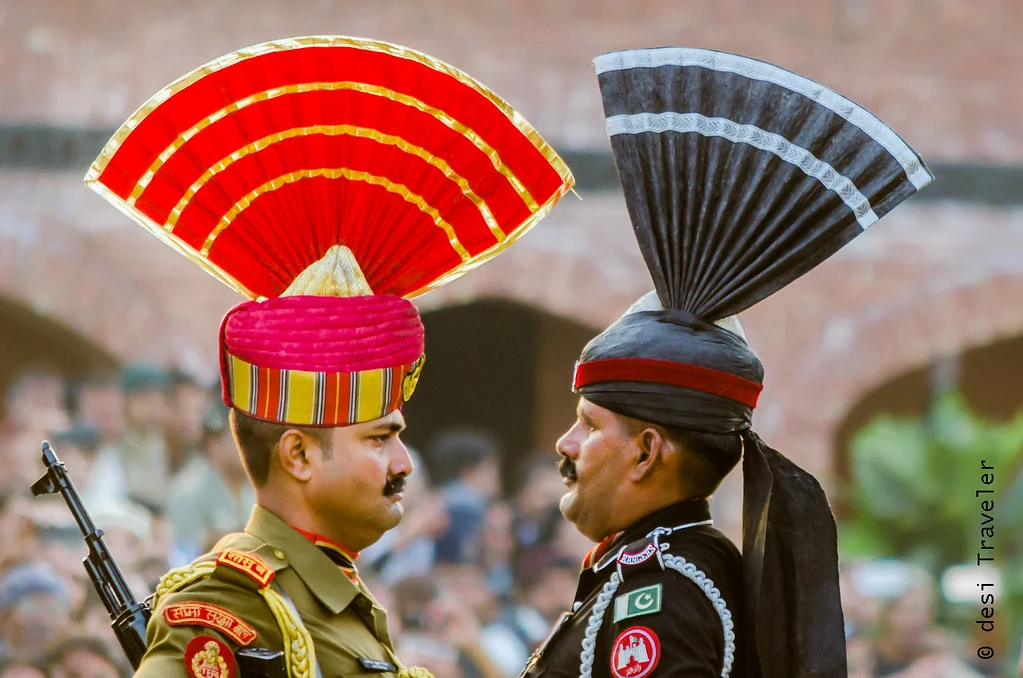 Border Security Force soldiers execute precise high kicks and marches at Wagah Border's Beating Retreat ceremony, showcasing national pride amid cheering crowds and the India-Pakistan gate