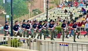 Women BSF soldiers performing a synchronized drill with rifles during the Beating Retreat Ceremony at Attari-Wagah Border, Amritsar, Punjab, India
